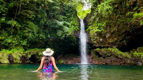 my-samoa-person-swimming-in-the-water-below-afu-aau-waterfall
